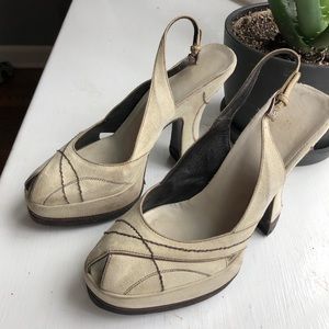 Prada cream suede peep-toe high heels.